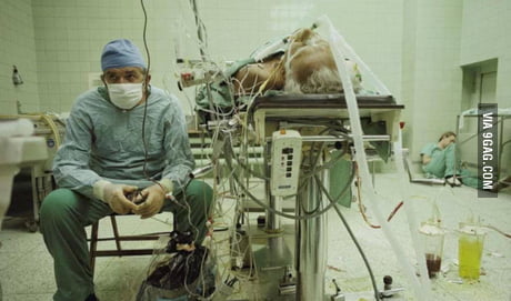Exhausted doctor and his assistant after heart transplant ...